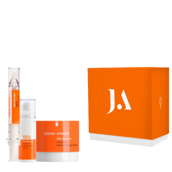 Skincare product set with orange packaging and 'J.A' logo