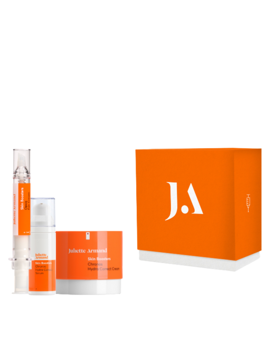 Skincare product set with orange packaging and 'J.A' logo