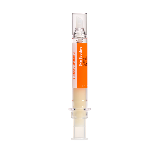 Small cylindrical container with an orange label