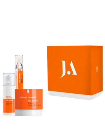 Juliette Armanet skincare products with orange packaging