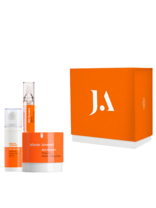 Juliette Armanet skincare products with orange packaging